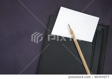 note and pencil on table in hotel room note and pencil on table in hotel room 96444977