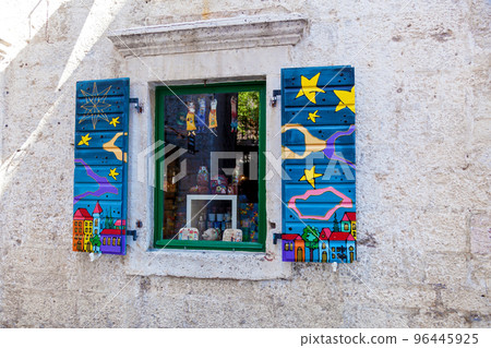 Bright patterns on wooden shutters Bright patterns on wooden shutters 96445925