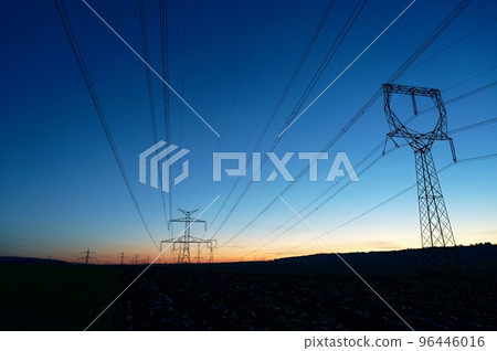 High voltage pylons. Rising energy prices - a concept for industry and energy. Increasing the price of electricity. Concept for industry and energy. The crisis in Europe caused by Russian aggression 96446016