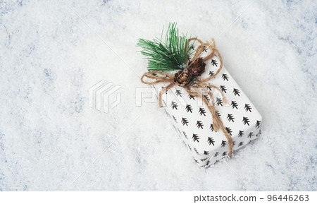 Christmas white gift box on the snow Christmas white gift box on the snow 96446263