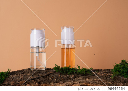 Glass bottles with skin care products on a beige background with natural materials Glass bottles with skin care products on a beige background with natural materials 96446264