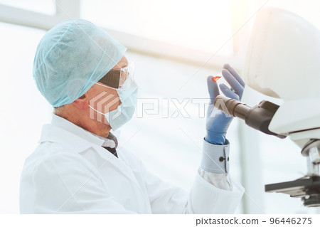 close up. scientist in testing a new drug in the lab . close up. scientist in testing a new drug in the lab . 96446275
