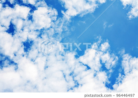 White fluffy clouds on a clear blue sky White fluffy clouds on a clear blue sky 96446497