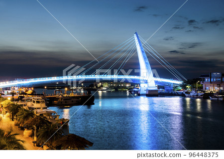 Sunset view of Lover's Bridg at Tamsui Fisherman's Wharf in New Taipei City, Taiwan. is a white Cable-stayed bridge. Sunset view of Lover's Bridg at Tamsui Fisherman's Wharf in New Taipei City, Taiwan. is a white Cable-stayed bridge. 96448375