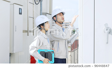 Engineer inspecting equipment 96448647