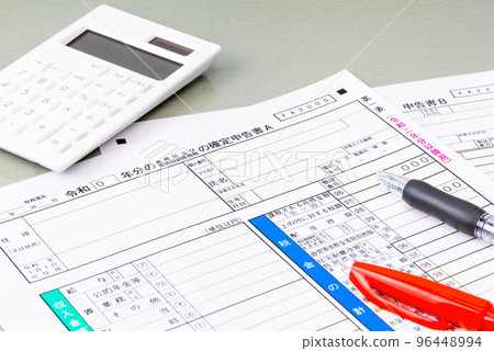 Tax return form, calculator, ballpoint pen and red pen (image of tax return) 96448994