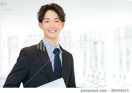 A businessman with a laptop computer 96449025