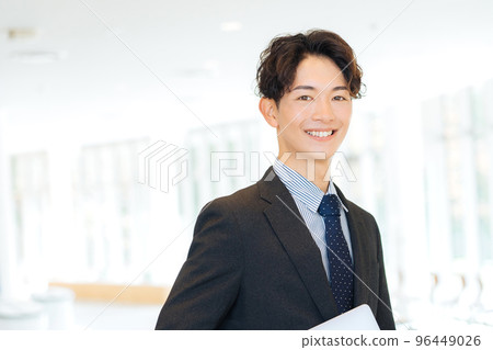 A businessman with a laptop computer 96449026