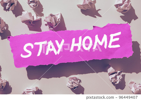 Text sign showing Stay Home. Word Written on not go out for an activity and stay inside the house or home 96449407