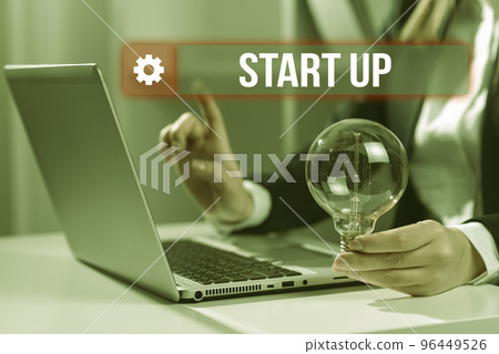 Hand writing sign Start Up. Internet Concept in the early process of establishing and developing a new business 96449526