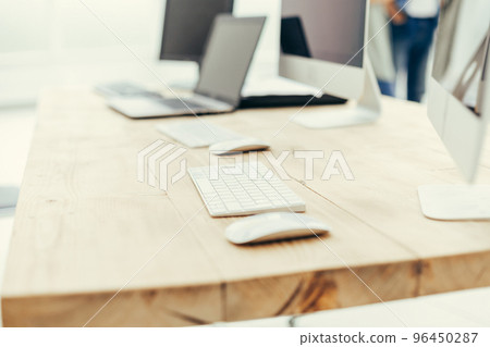 background image of computer and laptop on office Desk 96450287