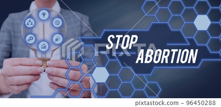 Text sign showing Stop Abortion. Business idea advocating against the practice of abortion Prolife movement Text sign showing Stop Abortion. Business idea advocating against the practice of abortion Prolife movement 96450288