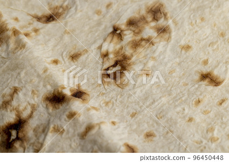 Wheat pita bread with dark spots Wheat pita bread with dark spots 96450448