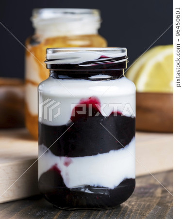 Yogurt made from fresh milk with the addition of sweet jam Yogurt made from fresh milk with the addition of sweet jam 96450601