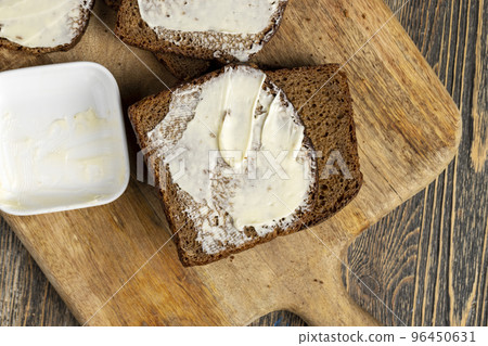 Black rye bread with butter Black rye bread with butter 96450631