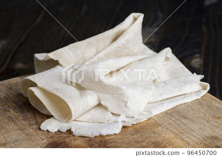 Fresh and soft wheat lavash on a board Fresh and soft wheat lavash on a board 96450700