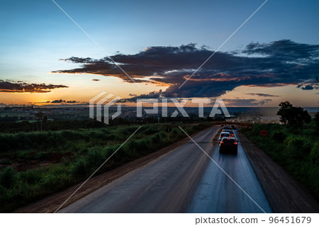 sunset over the road with cars sunset over the road with cars 96451679