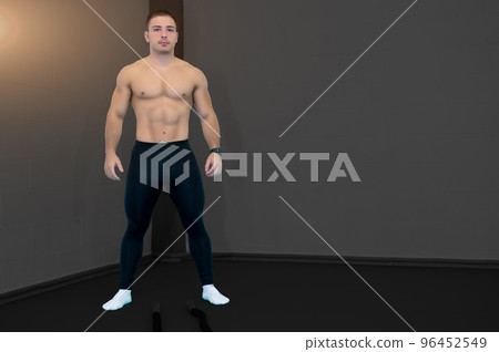 Nice picture with charming young shirtless Caucasian male athlete posing in front of battle ropes. Look into camera. Confident and positive success concept. Goal achievement. Copy space. Nice picture with charming young shirtless Caucasian male athlete posing in front of battle ropes. Look into camera. Confident and positive success concept. Goal achievement. Copy space. 96452549