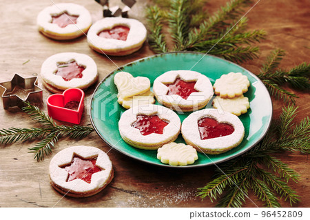 Classic Linzer Christmas Cookies with raspberry or strawberry jam on wooden table Classic Linzer Christmas Cookies with raspberry or strawberry jam on wooden table 96452809