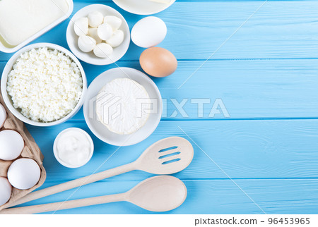 dairy products on blue wooden background, top view dairy products on blue wooden background, top view 96453965