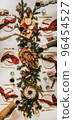 Flat-lay of Peoples hands with wine in glasses 96454527