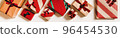 Flat-lay of festive gift boxes in wrapping paper 96454530