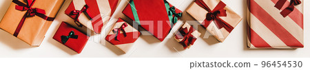 Flat-lay of festive gift boxes in wrapping paper Flat-lay of festive gift boxes in wrapping paper 96454530