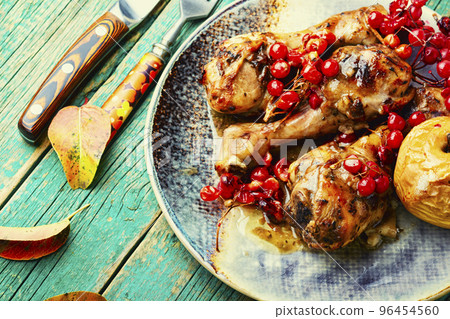 Chicken legs with apple and berries Chicken legs with apple and berries 96454560