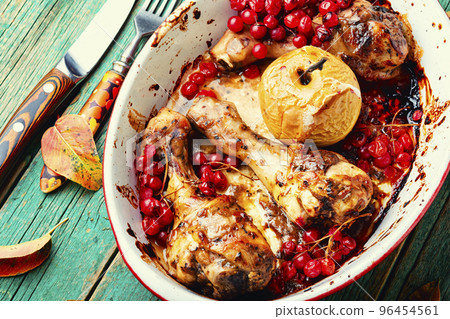Chicken legs roasted with apples and rowan Chicken legs roasted with apples and rowan 96454561