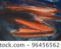abstract orange paint brush strokes on black and dark blue watercolor background 96456562
