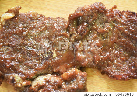grilled beef steak dressing barbecue sauce  with French fries and salad on chopping block in white background  96456616