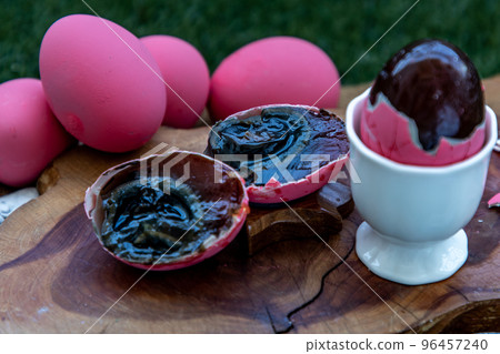 Pink Century eggs (Pidan Eggs) also known as preserved egg, hundred-year egg, thousand-year egg are a Chinese preserved food product and delicacy made by preserving duck, chicken in A Mixture of Ash, Pink Century eggs (Pidan Eggs) also known as preserved egg, hundred-year egg, thousand-year egg are a Chinese preserved food product and delicacy made by preserving duck, chicken in A Mixture of Ash, 96457240