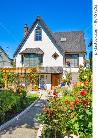 Old style family house with landscaped front yard Old style family house with landscaped front yard 96457252