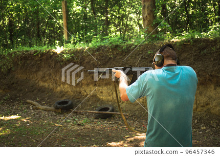 A Ukrainian civilian man is training to shoot an Akm A Ukrainian civilian man is training to shoot an Akm 96457346