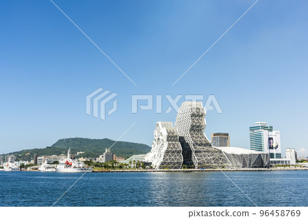 Building view of Kaohsiung Music Center in Port of Kaohsiung, Taiwan. The white hexagonal building structure on the shore of love pier. 96458769