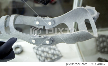 Gray orthopedic plastic prosthesis printed on powder 3D printer for cubit hand. Orthopedic gypsum helmet closeup. Multi Jet Fusion MJF 3D printing technology. New modern progressive additive technolog 96458867
