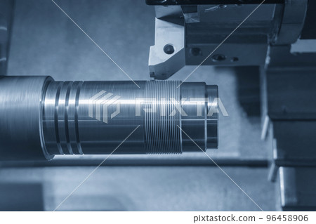 The CNC lathe machine thread cutting at the metal shaft parts. 96458906