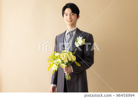 A groom with a bouquet A groom with a bouquet 96458994