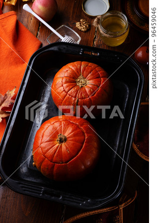 baked pumpkin cream coup served in pumpkins. served at wooden rural brown table. cooking recipe. healthy life concept baked pumpkin cream coup served in pumpkins. served at wooden rural brown table. cooking recipe. healthy life concept 96459046