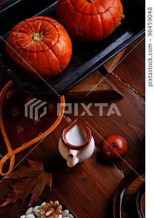 baked pumpkin cream coup served in pumpkins. served at wooden rural brown table. cooking recipe. healthy life concept baked pumpkin cream coup served in pumpkins. served at wooden rural brown table. cooking recipe. healthy life concept 96459048