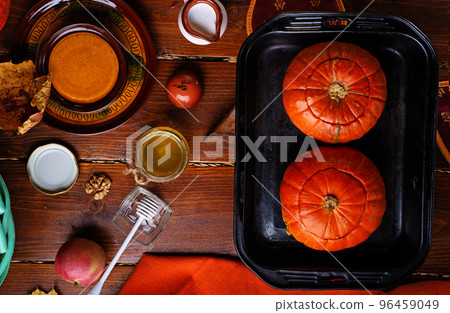 baked pumpkin cream coup served in pumpkins. served at wooden rural brown table. cooking recipe. healthy life concept baked pumpkin cream coup served in pumpkins. served at wooden rural brown table. cooking recipe. healthy life concept 96459049