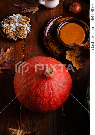 ripe pumpkin served at wooden rural brown table. cooking and healthy life concept ripe pumpkin served at wooden rural brown table. cooking and healthy life concept 96459050
