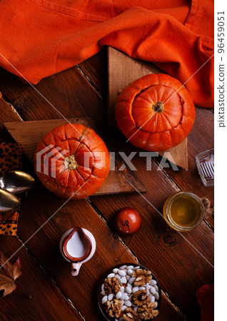 baked pumpkin cream coup served in pumpkins. served at wooden rural brown table. cooking recipe. healthy life concept baked pumpkin cream coup served in pumpkins. served at wooden rural brown table. cooking recipe. healthy life concept 96459051