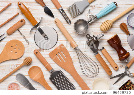 Set of kitchen utensils pattern on white wooden table background top view. Various cooking tools  96459720