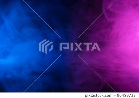 Clouds of colorful smoke in blue and purple neon light swirling on black table background Clouds of colorful smoke in blue and purple neon light swirling on black table background 96459732