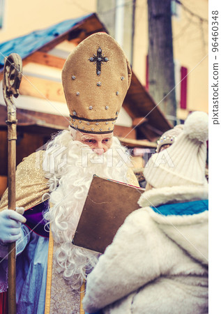 St Nikolaus meeting a child on the Christmas Market St Nikolaus meeting a child on the Christmas Market 96460348