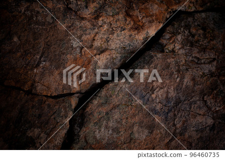 Crack in the rock on mountain in dark mood. Crack in the rock on mountain in dark mood. 96460735