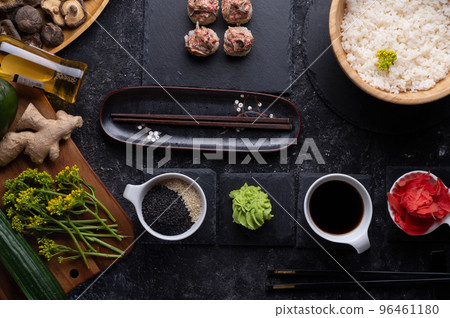 sushi roll set with shiitake mushrooms with rice served at gblack dish at black table. flat lay sushi roll set with shiitake mushrooms with rice served at gblack dish at black table. flat lay 96461180