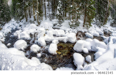 Frozen river in winter forest. Frozen river in winter forest. 96461545