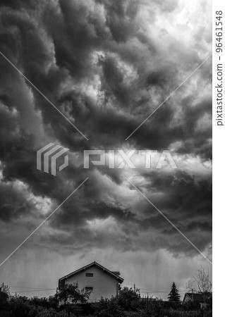 Dark stormy clouds over house Dark stormy clouds over house 96461548